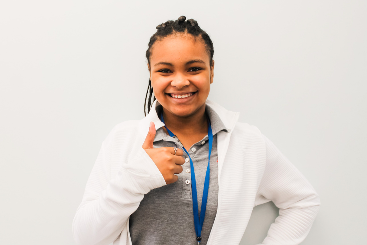 Smiling Palmetto Orthodontics Patient Giving A Thumbs Up