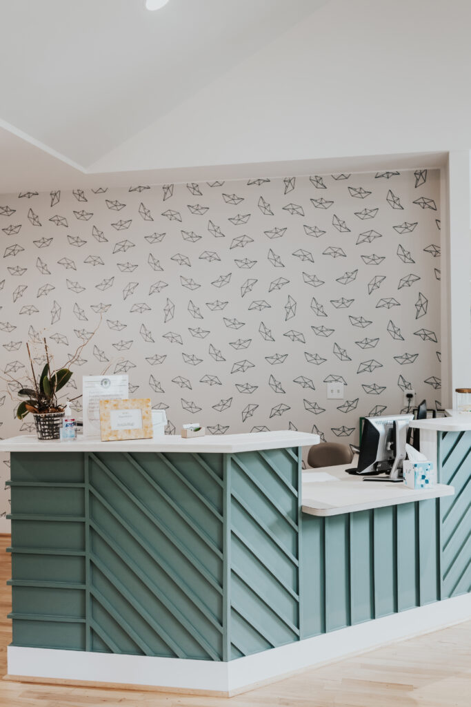 Interior of Greenville East Faris Orthodontics office with sailboat origami wallpaper